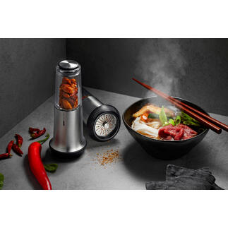 Chili-snijden X-Plosion® naast een kom met dampend eten