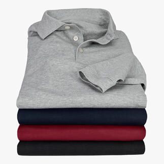 Gestapelde Pima-interlock polos in verschillende kleuren: grijs en marineblauw.
