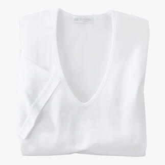 Wit Sunspel-shirt ligt gevouwen op een tafel.