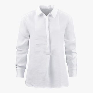 Vooraanzicht van een witte linnen tuniek met knoopsluiting.