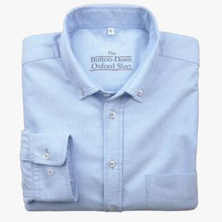 Lichtblauw shirt, opgevouwen, maat 38 cm met knoopkraag.