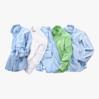 Verschillende BDO-shirts in verschillende kleuren op een tafel.