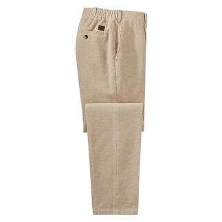Beige corduroy broeken, opgevouwen, goed zichtbaar.
