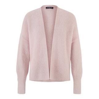 Roze Junghans 1954 fluffy cardigan op een lichte achtergrond.