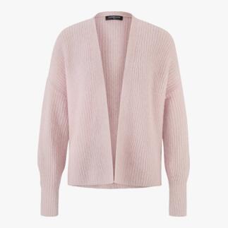 Roze Junghans 1954 fluffy cardigan op een lichte achtergrond.