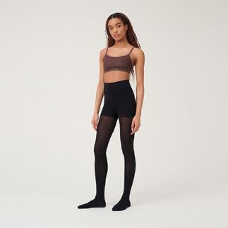 Vrouw draagt een zwarte beauty panty met een bruin topje.