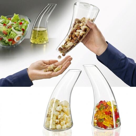 Snackdispenser in de vorm van een karaf met noten en snoepjes.