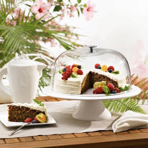 Taartbell met cake en fruit op een tafel