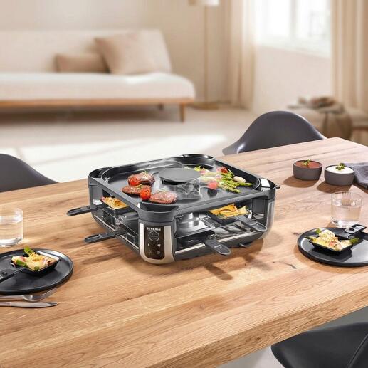 Raclette-grill met ingebouwde rookafzuiging op een gedekte tafel.