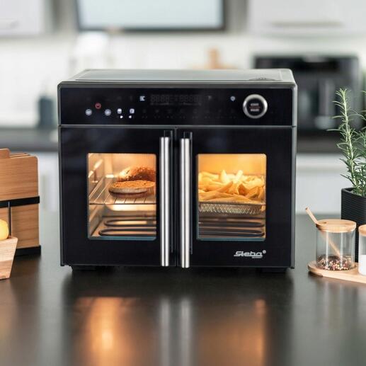Airfry-grilloven Tri-Zone met open deuren en zichtbare frietjes.