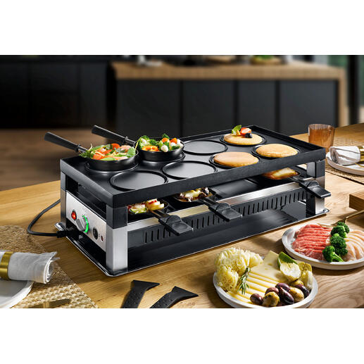 Solis raclette- en fun-koken 5-in-1 apparaat met groenten en vlees op de tafel.
