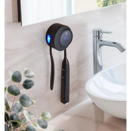 UV-tandenborstel disinfectie station aan de muur met zwart ontwerp en LED-display.