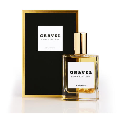 Gravel Eau de Parfum Spray naast de zwarte verpakking