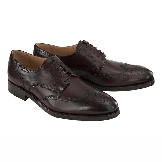 Twee bruine Cordwainer business schoenen met perforaties, vooraanzicht.