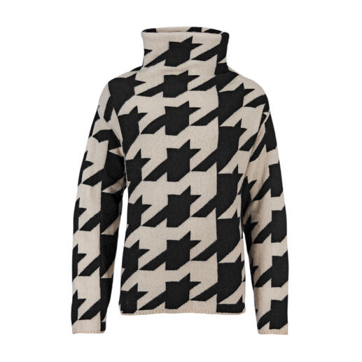 Houndstooth kasjmier pullover in zwart en wit, van voren gefotografeerd.