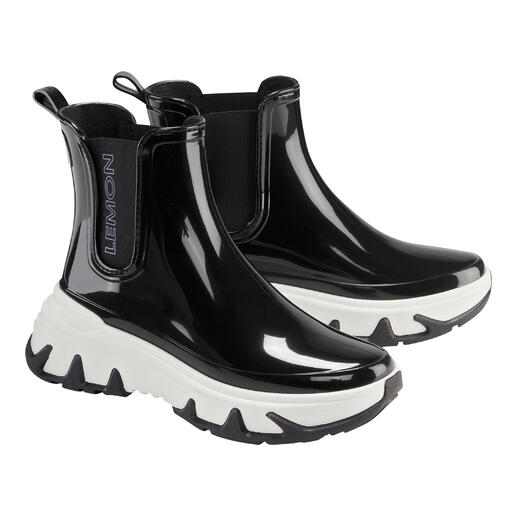 Zwarte en witte Lemon Jelly Chelsea-sneakerboots met een glanzend oppervlak.