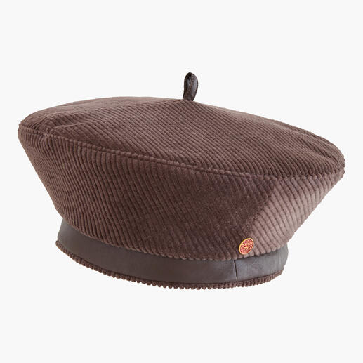 Bruine corduroy baret van de zijkant, toont de vorm en het materiaal.