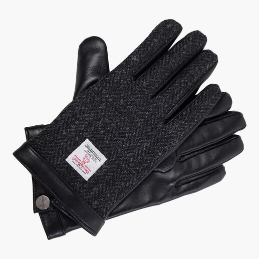 Zwarte Harris Tweed handschoen met leren details op een witte achtergrond