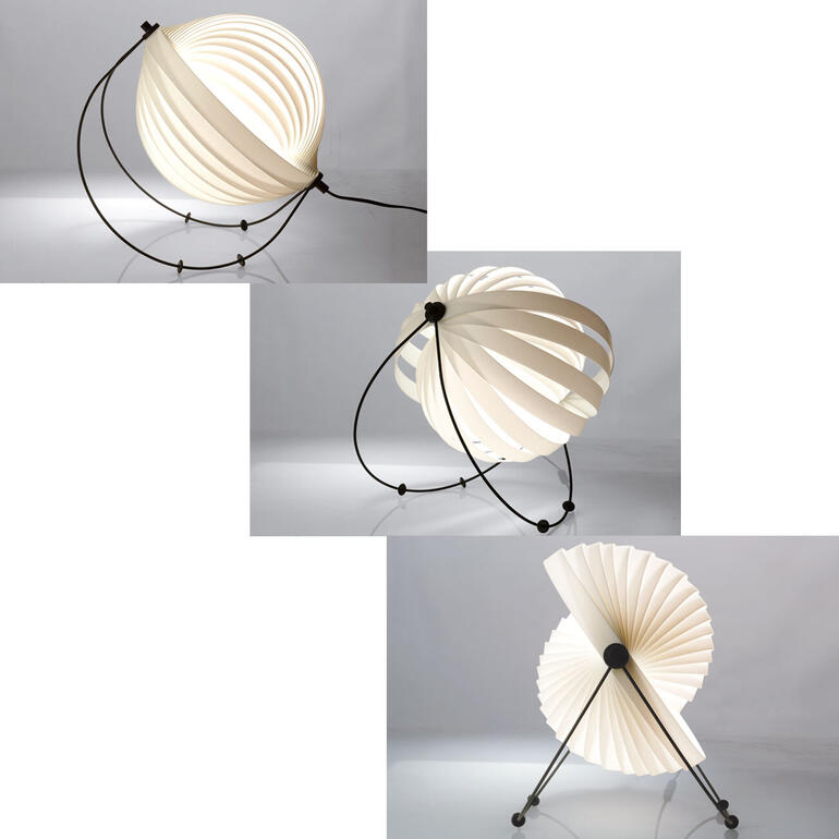 Dankzij 4 beweegbare kunstof pootjes op de zwarte metalen boog kunt u de helling van de lamp evenals de lichtreflectiehoek bepalen. Designlamp