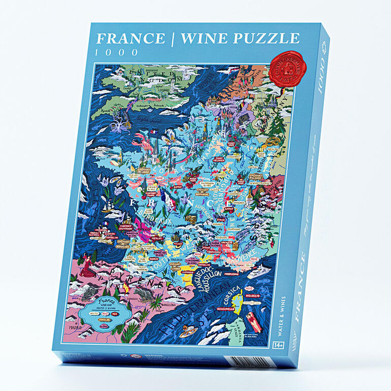 Verpakking van de Frankrijk wijnpuzzel met kleurrijke kunst.