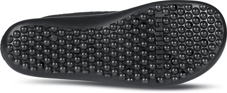 Onderkant van een zwarte Barfuß-leguano® sneaker met antislipprofiel.