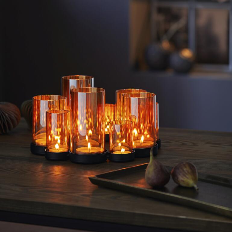 Windlicht Lichtermeer van oranje glazen met kaarsen.