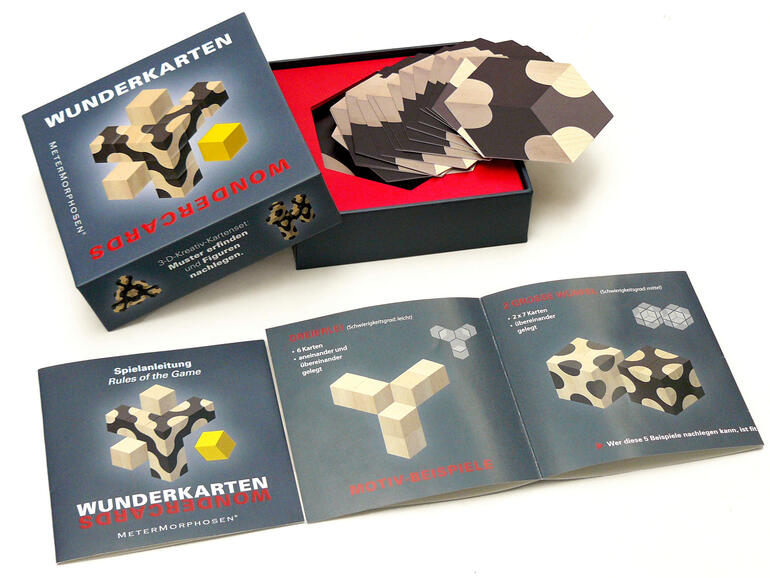 Wunderkarten spellen doos en kaarten met spelinstructies.