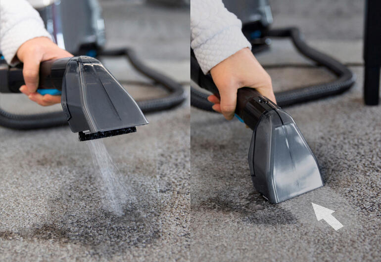 Verwijdert vlekken en vuil moeiteloos – gewoon inspuiten, uitborstelen en meteen opzuigen. Hand die de compacte stofzuiger gebruikt