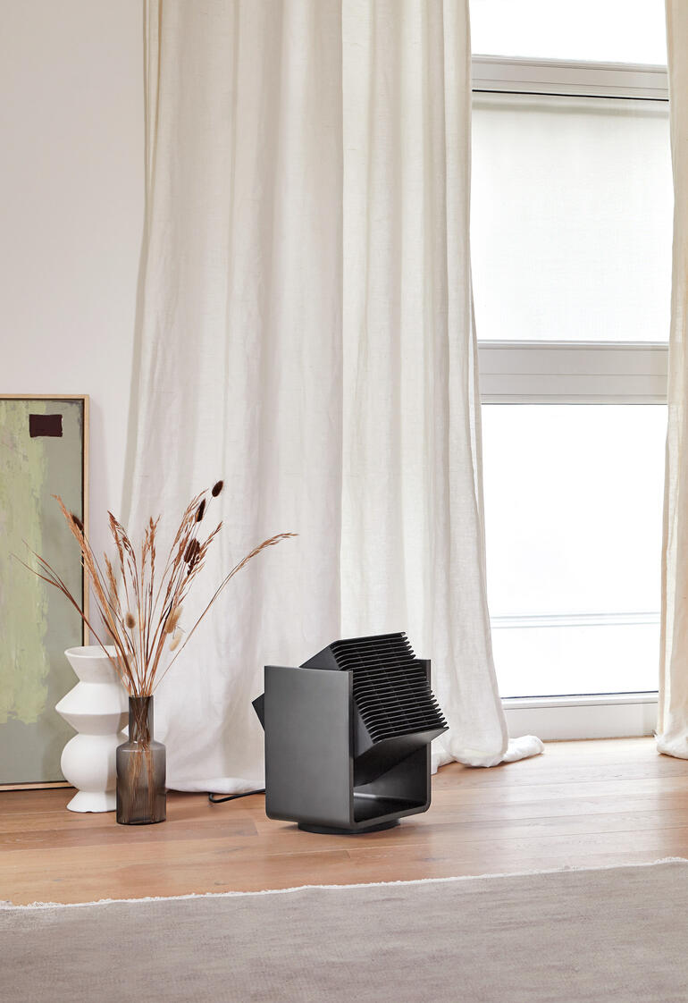 ALEX 2-in-1 verwarmings- en ventilator in moderne woonruimte.