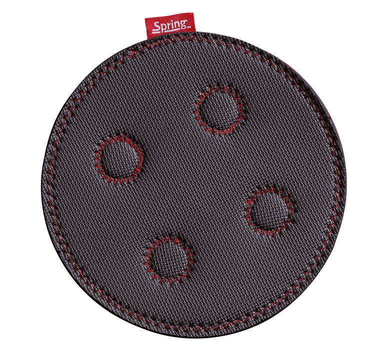 Ronde magnetische onderzetter met drie uitsparingen.