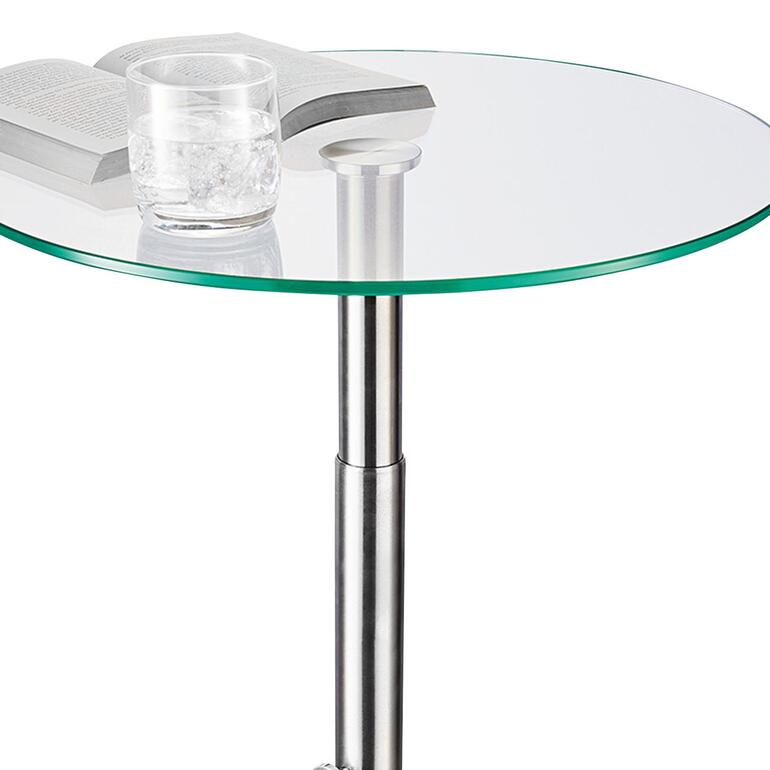 Glazen bijzettafeltje Bovenaanzicht van een glazen bijzettafel met boek en glas.