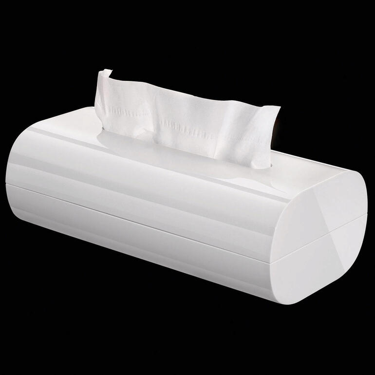 Tissuebox Doos voor cosmetische tissues van Alessi tegen een zwarte achtergrond.