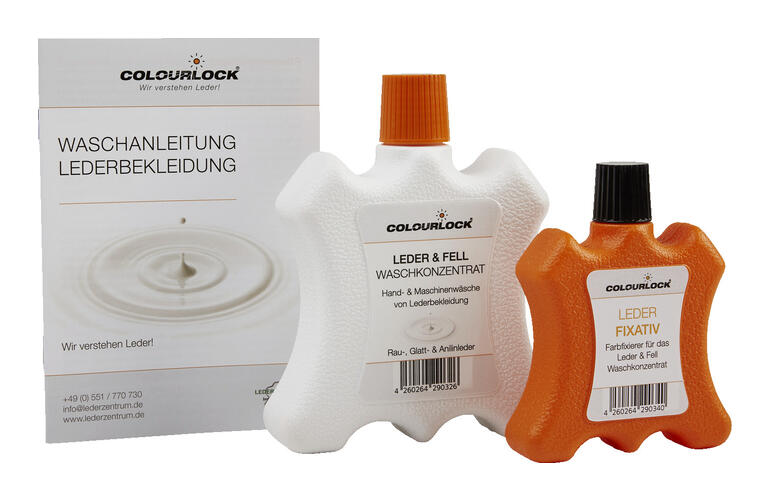 Fles leer- en vachtwasconcentraat naast fixatief.