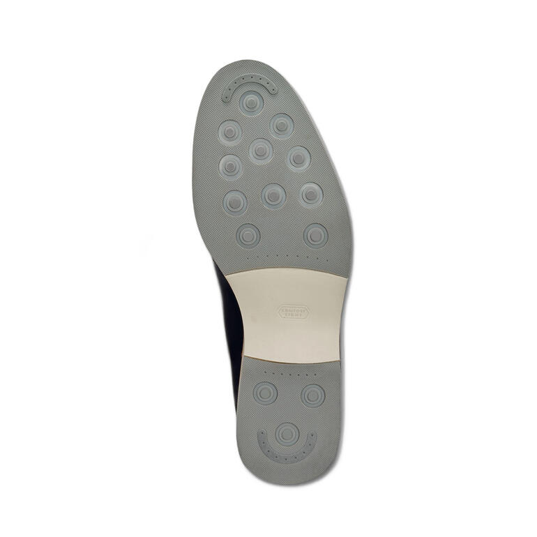 Zool van een donkerblauwe Cordwainer sneaker.