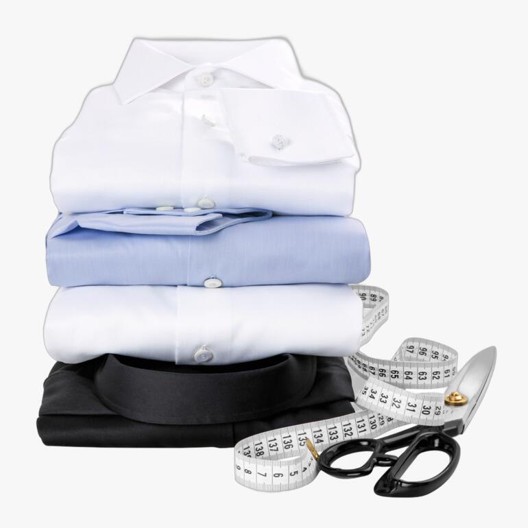 Gestapelde hemden in verschillende kleuren voor maatwerk