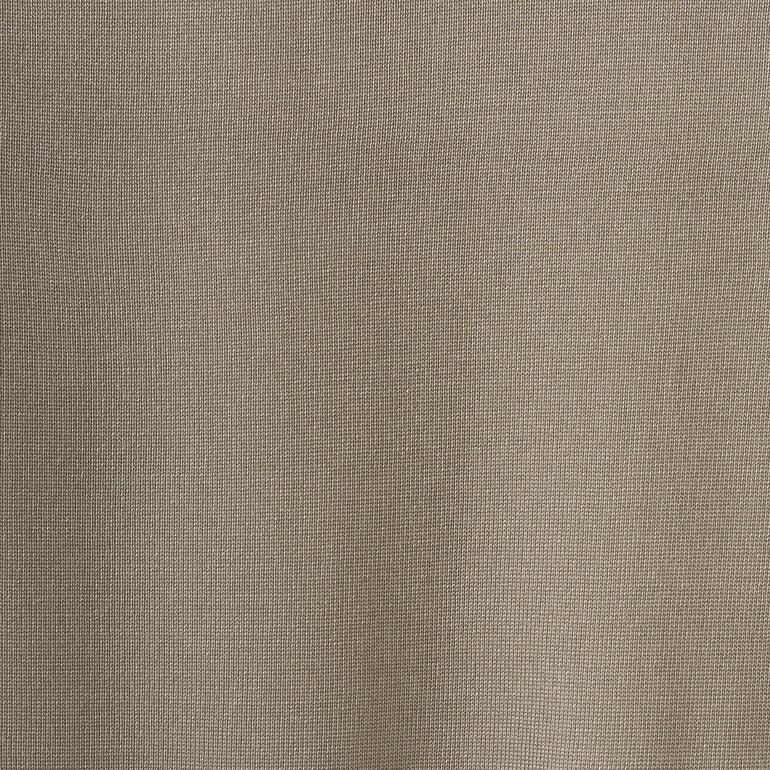 Close-up van beige zijde materiaal.