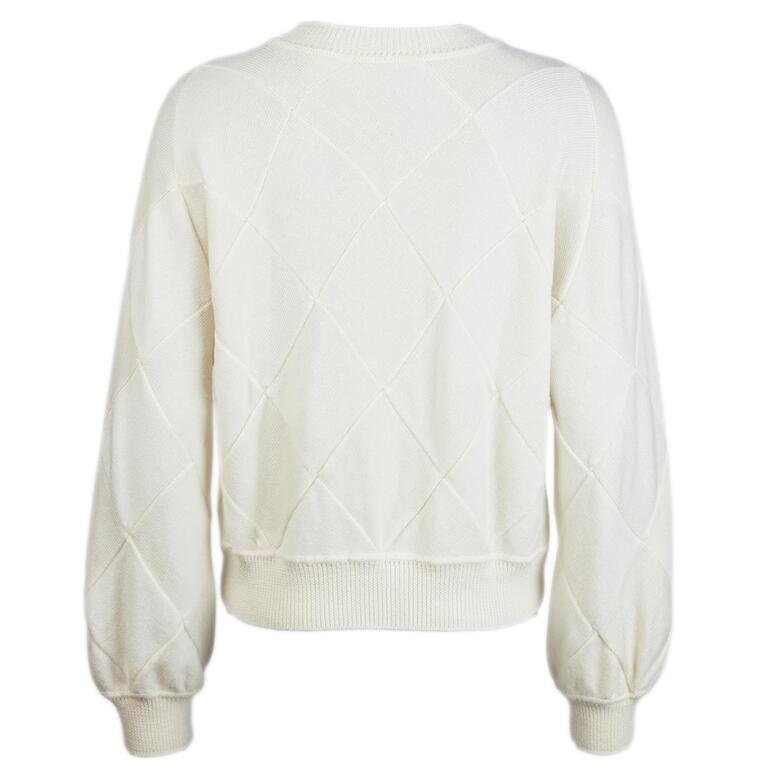 Achteraanzicht van een lichtgele trui met diagonaal breipatroon.