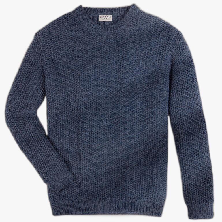 Grijze Alpaka-Honeycomb-trui op een witte achtergrond