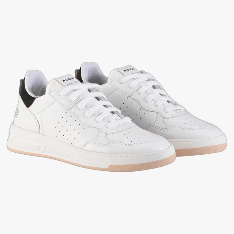WOMSH vintage sneakers in wit, lichte zijaanzicht.