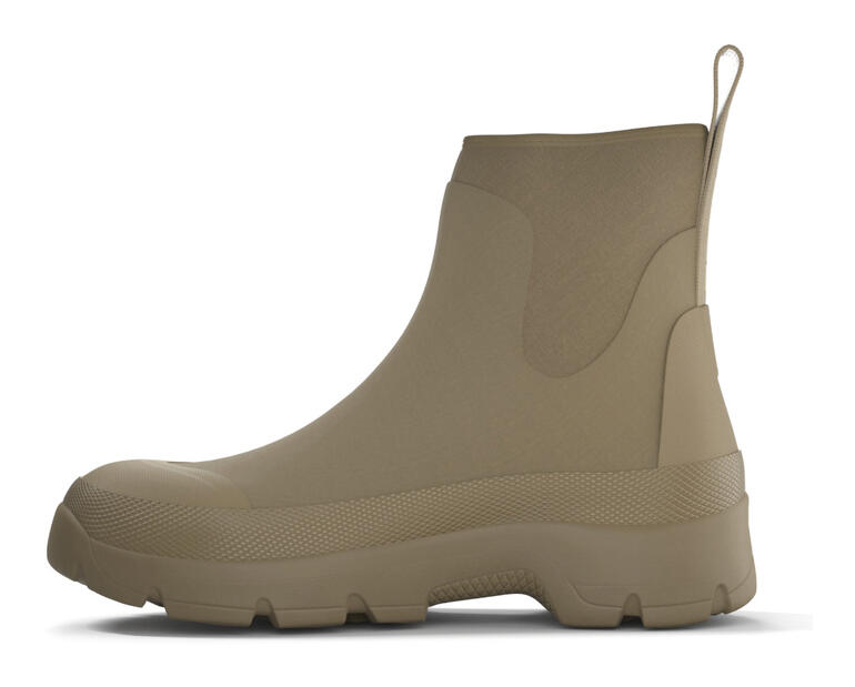 Zijaanzicht van een beige Tretorn neopreen Chelsea-boot met patroon.